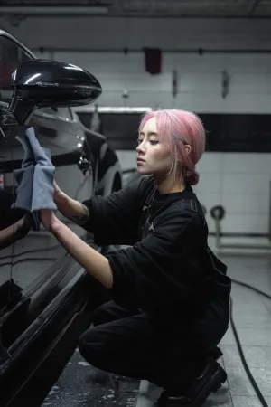 Black Car being detailed by girl